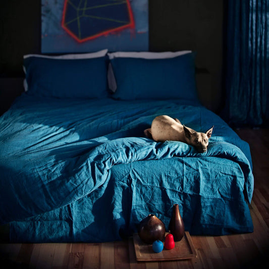 Sea blue linen duvet cover on queen bed, made from 100% European stonewashed flax